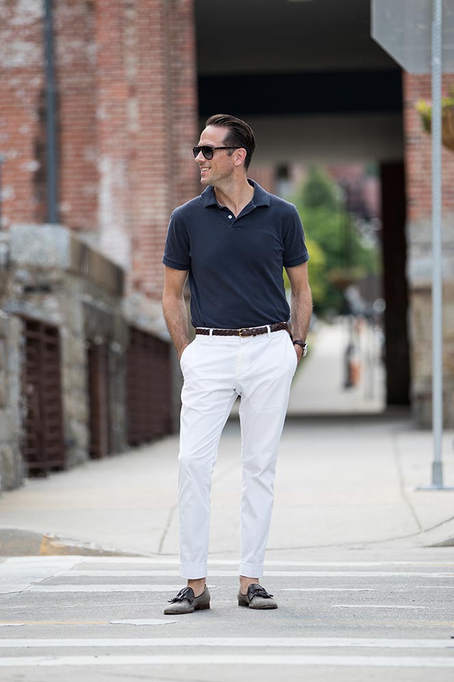 navy blue polo shirt white cotton pants simple casual mens summer outfit idea 1
