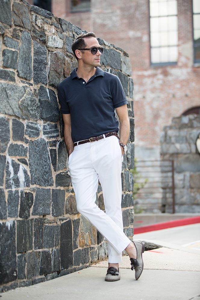 navy blue polo shirt white cotton pants simple casual mens summer outfit idea 3