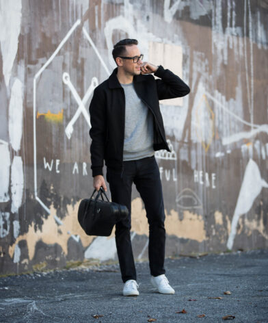 Black Wool Bomber with Jeans and White Sneakers | He Spoke Style