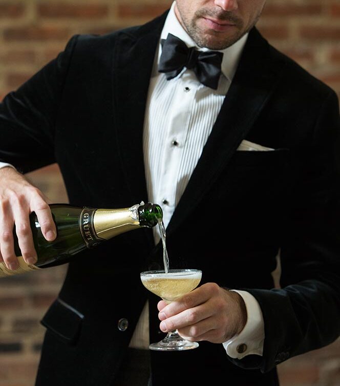 how to hold a champagne glass
