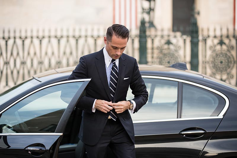 getting-out-of-black-bmw-in-navy-suit-mens-business-outfits-outfit-ideas