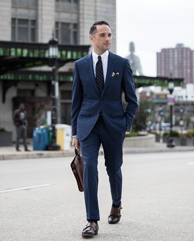 classic blue suit striped tie briefcase double monk strap mens business outfit ideas 5