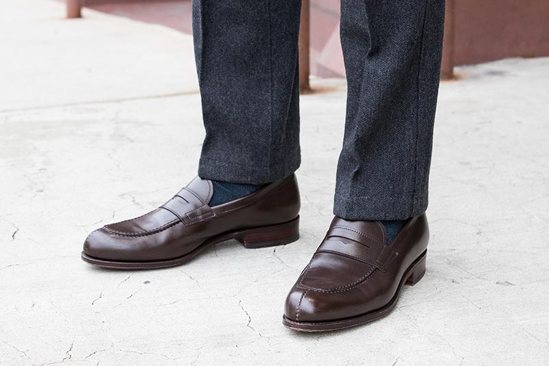 dark-brown-leather-penny-loafers-blue-socks-grey-pants