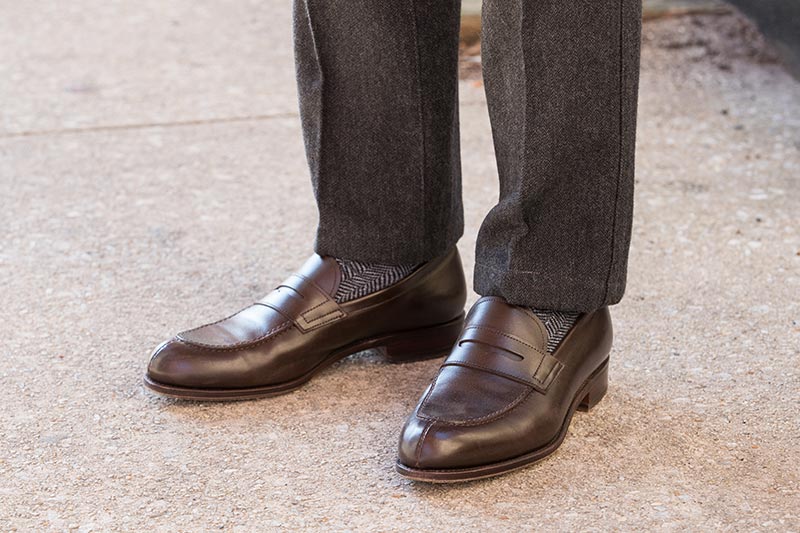 dark-brown-leather-penny-loafers-with-grey-pants-herringbone-socks