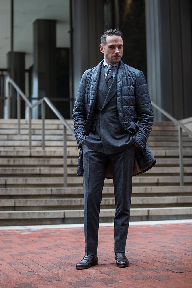 mens-business-outfit-ideas-for-winter-medium-grey-flannel-double-breasted-suit-with-quilted-jacket-loafers-stiped-tie
