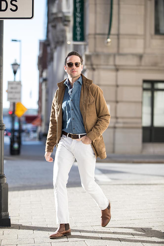 tan-suede-safari-jacket-denim-shirt-white-jeans-brown-leather-chelsea-boots-mens-outfit-idea-spring-style-essentials-1