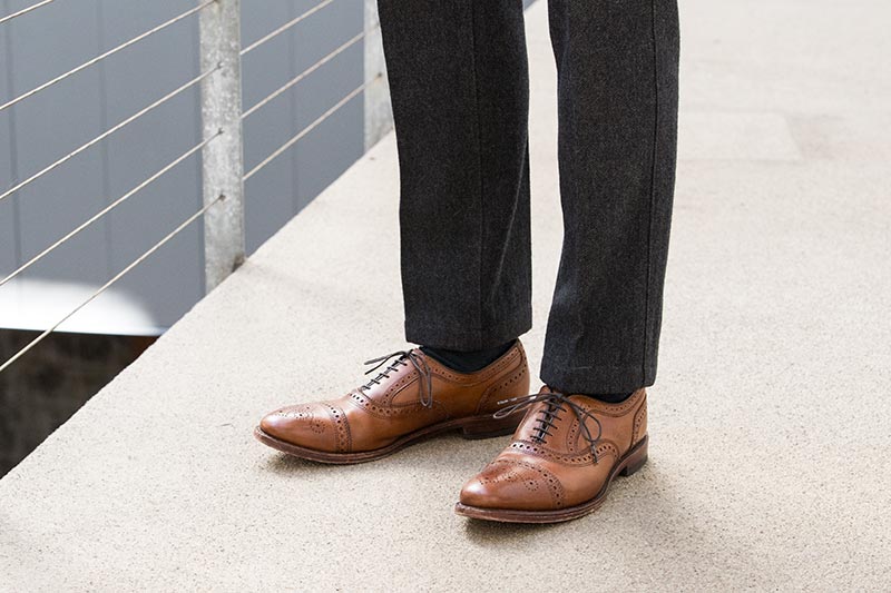 walnut-leather-brogue-cap-toe-shoes-allen-edmonds-strand-with-grey-pants-classic-mens-style