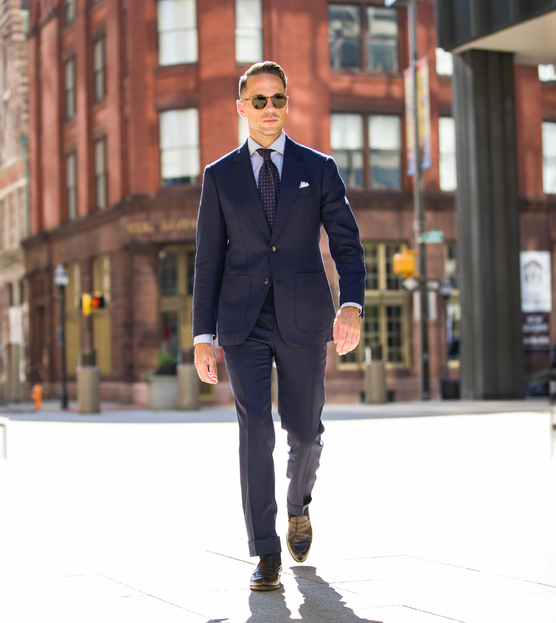 navy hopsack suit with blue shirt and loafers outfit