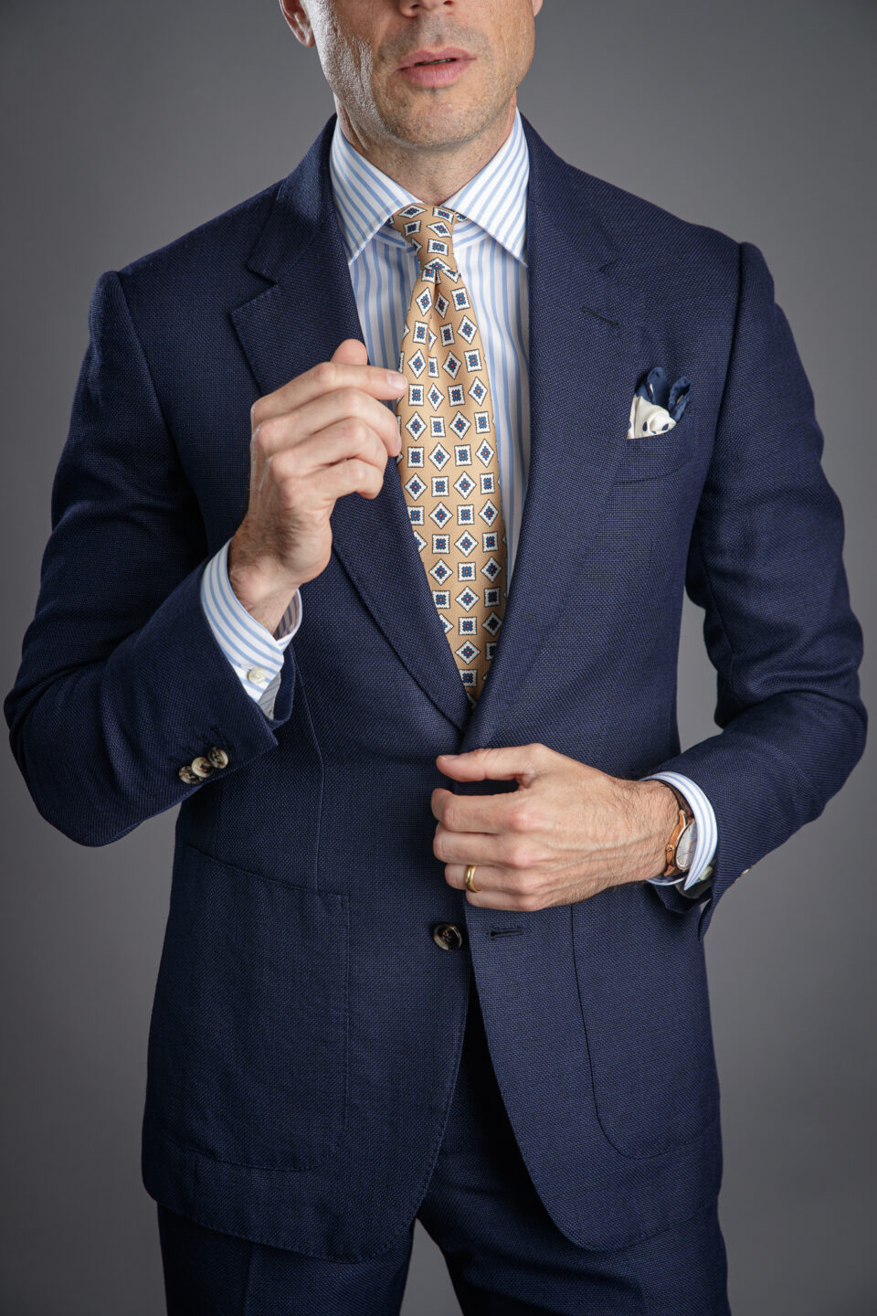 https://hespokestyle.com/wp-content/uploads/2020/09/navy-hopsack-suit-with-striped-shirt-medallion-tie-business-outfit-ideas-mens-he-spoke-style-michael-andrews-bespoke-custom-made-to-measure-suits-online-960x1440.jpg