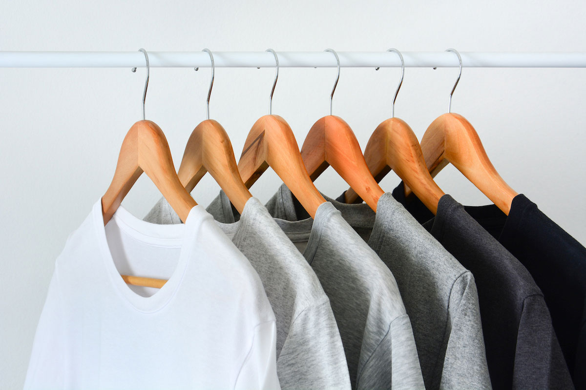 Premium Photo  Colorful tshirts in sale hanging from the hangers in