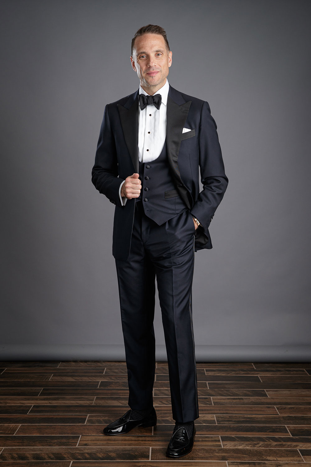 Midnight navy blue tuxedo with vest for a black tie optional wedding