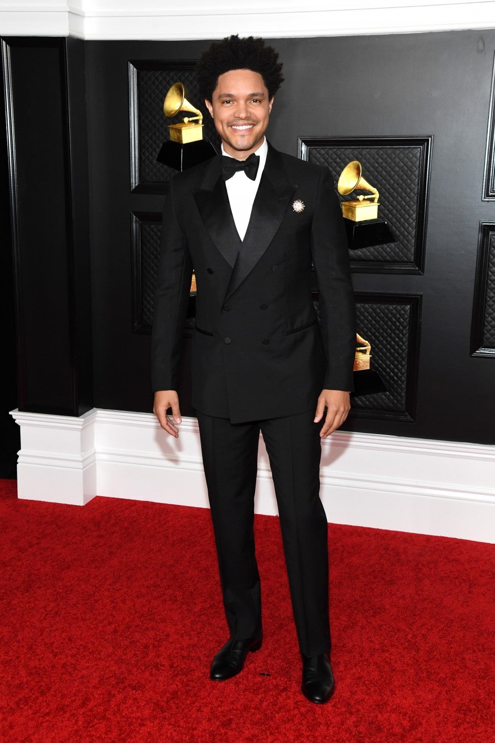 Trevor Noah in a double-breasted shawl collar tuxedo at the 2021 Grammy Awards