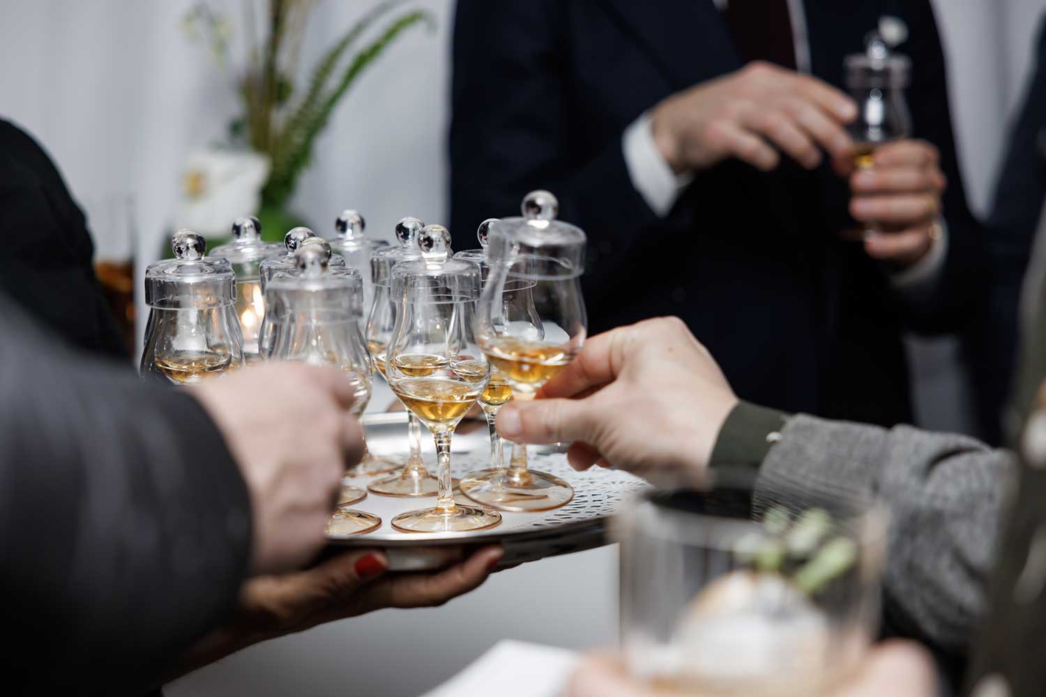 Guests grabbing tasting glasses of The Glenrothes 36 year old single cask