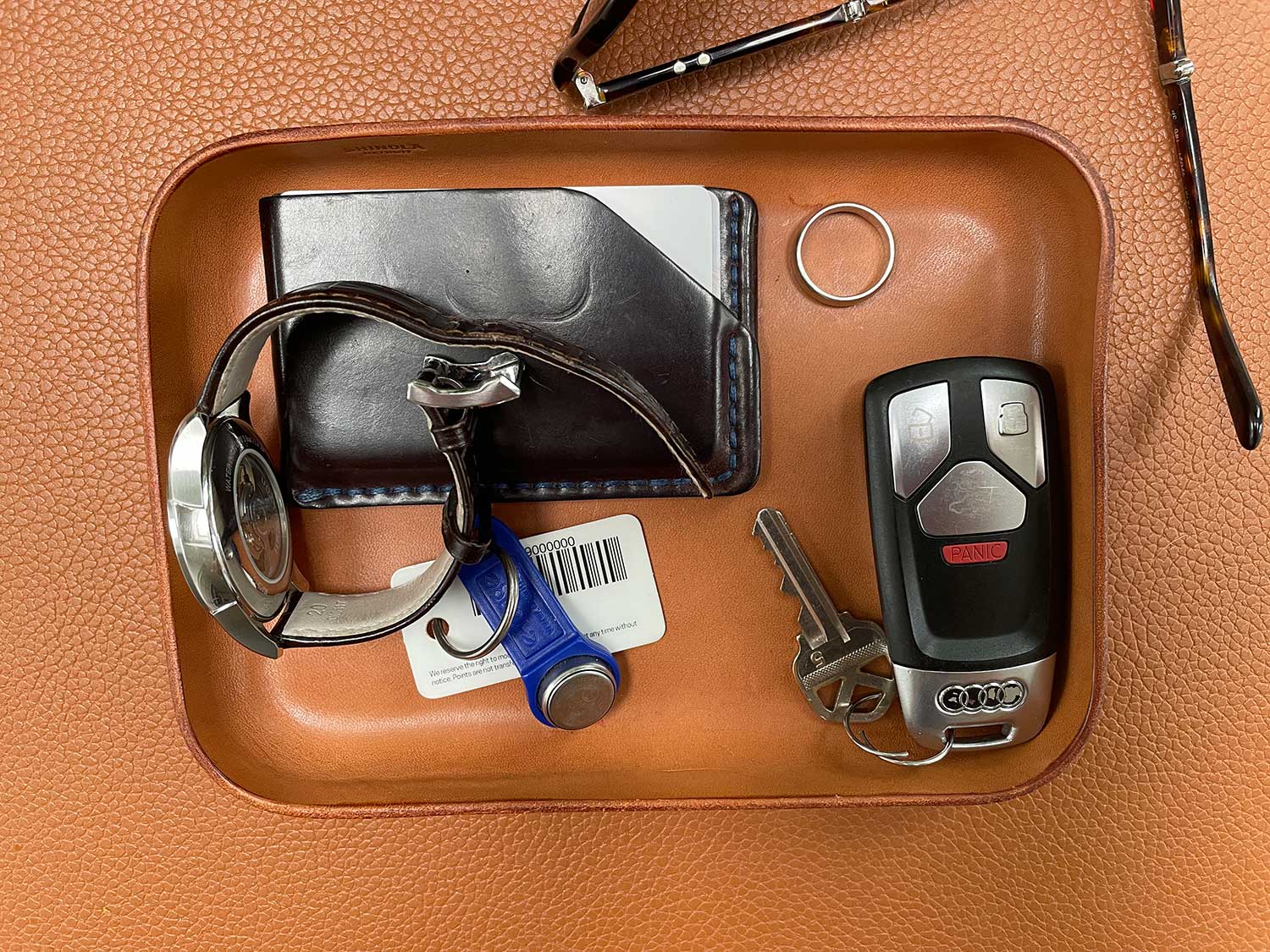 A leather catch-all helps keep EDC organized.