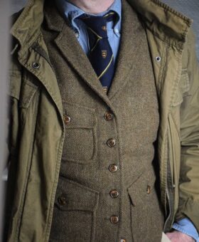 tweed vest over denim shirt with club tie