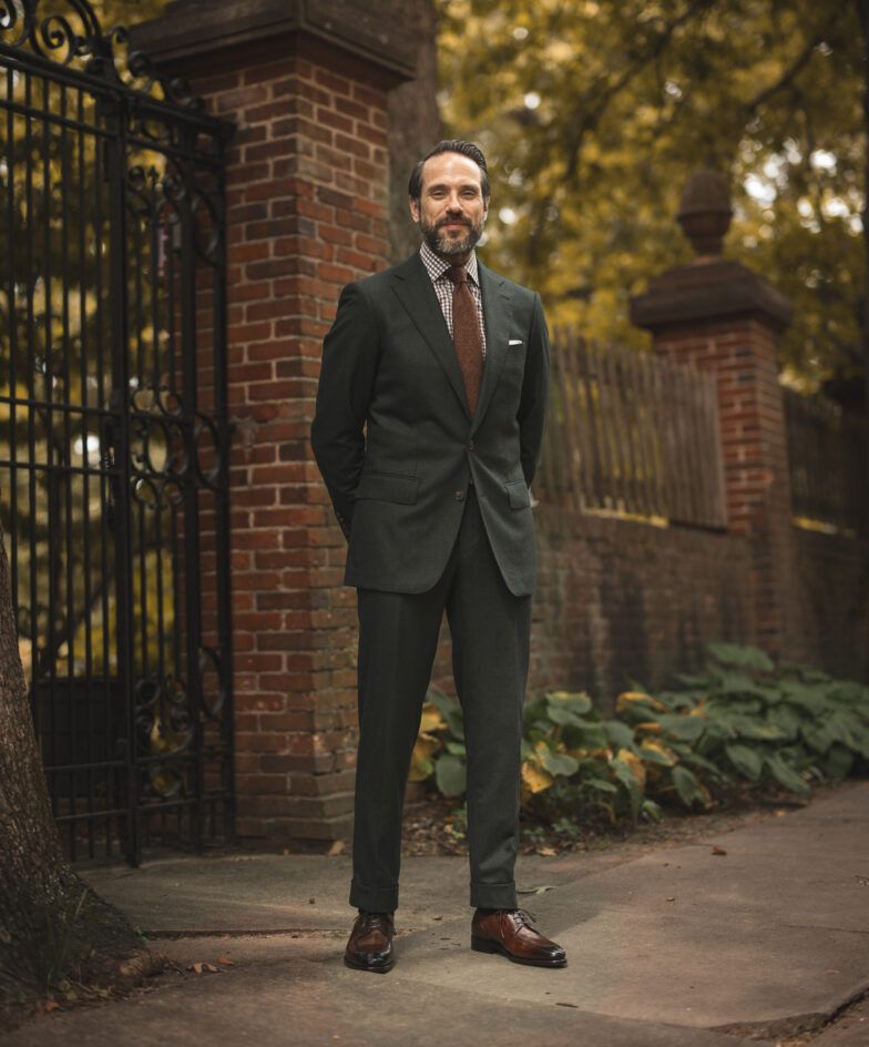 Rust tie with a light blue suit with chalk stripes