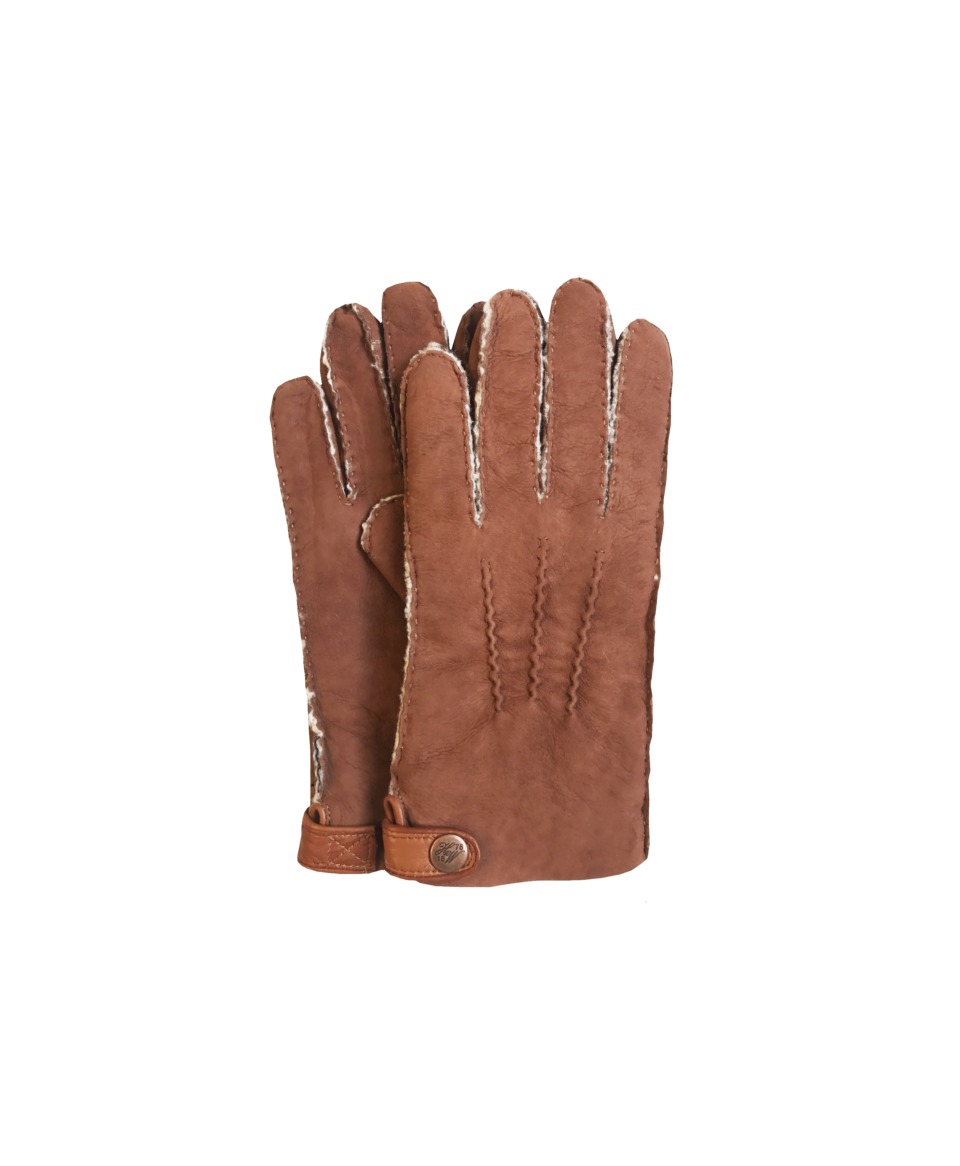 Tan shearling-lined leather gloves with handsewn points and snap tab cuff, flat lay pair
