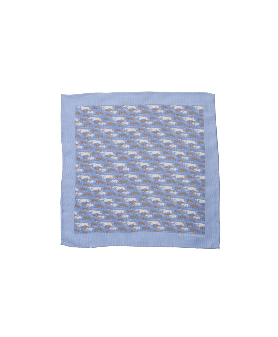 Light blue pocket square with tan and white hunting hound print and hand-rolled edges, flat lay