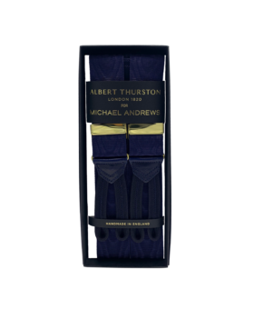 Navy moire suspenders with gold hardware and leather ends, in a gift box