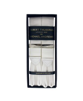 White solid suspenders with silver hardware and white leather ends, in a gift box