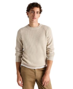 Speckled beige ribbed cotton crewneck sweater with white tee and khaki chinos, worn by a model