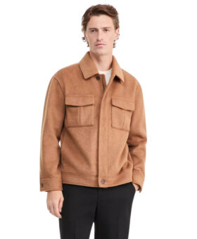 Camel wool blend zip-front shirt jacket with flap chest pockets, worn with black trousers by a model